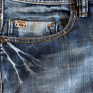 2 pairs jeans and 1 pair of kuhl men’s shorts.